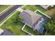 A beautiful aerial view of a house with a screened-in pool and a well-maintained lawn at 690 Cascading Creek Ln, Winter Garden, FL 34787