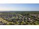 An aerial shot showcases a beautiful residential community with well-maintained landscapes and serene surroundings at 690 Cascading Creek Ln, Winter Garden, FL 34787