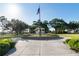 Scenic community park showcasing an American flag, a charming gazebo, and well-manicured lawns at 690 Cascading Creek Ln, Winter Garden, FL 34787
