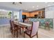 Dining room with breakfast bar and open floor plan at 690 Cascading Creek Ln, Winter Garden, FL 34787