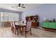Dining room with light wood floors, statement furniture, and lots of natural light at 690 Cascading Creek Ln, Winter Garden, FL 34787