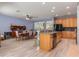 Dining room with breakfast bar and open floor plan at 690 Cascading Creek Ln, Winter Garden, FL 34787