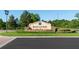 Elegant 'Black Lake Park' entrance sign with stone accents, set amidst beautifully landscaped grounds at 690 Cascading Creek Ln, Winter Garden, FL 34787