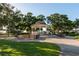 Picturesque gazebo in a serene park setting, surrounded by lush greenery and inviting walkways at 690 Cascading Creek Ln, Winter Garden, FL 34787