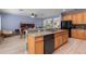 Spacious kitchen with hardwood floors, oak cabinets, and stainless steel appliances at 690 Cascading Creek Ln, Winter Garden, FL 34787
