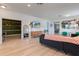 Spacious open-concept living room with wood floors, modern decor, and plenty of natural light at 690 Cascading Creek Ln, Winter Garden, FL 34787