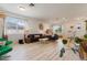 Spacious living area with hardwood flooring, lots of natural light, and stylish decor at 690 Cascading Creek Ln, Winter Garden, FL 34787