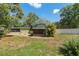 Quaint home boasts a screened lanai overlooking the yard at 9500 Shortleaf Ct, Apopka, FL 32703