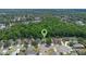 Aerial view showcases the home in its community near a wooded area at 1111 Brielle Ct, Oviedo, FL 32765
