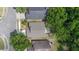 An aerial view of the roof and backyard of a home in a wooded neighborhood at 1111 Brielle Ct, Oviedo, FL 32765