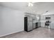 Well-equipped kitchen with stainless steel appliances, gray cabinetry, and tiled flooring, offering both style and functionality at 1111 Brielle Ct, Oviedo, FL 32765