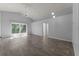 Spacious living room featuring tile floors, ample natural light, and access to the outdoors through sliding glass doors at 1111 Brielle Ct, Oviedo, FL 32765
