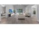 Bright living room boasts tile floors, sliding glass doors, and neutral décor for a modern, airy feel at 1111 Brielle Ct, Oviedo, FL 32765