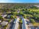 An aerial view of a well-situated apartment complex with a swimming pool, court, and ample green space at 1227 Carriage Ln, Orlando, FL 32807