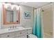Bathroom with modern fixtures, a shower-tub combination, and vanity with granite countertops at 1227 Carriage Ln, Orlando, FL 32807