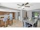 Dining area flows into a kitchen with breakfast bar seating at 1227 Carriage Ln, Orlando, FL 32807