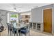 Inviting dining area near the kitchen, featuring a sliding door to the outside at 1227 Carriage Ln, Orlando, FL 32807