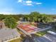Aerial view of the community playground and basketball court, with a glimpse of the pool area at 1227 Carriage Ln, Orlando, FL 32807