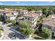 View of a beautiful townhome community surrounded by lush, mature trees at 1339 Shinnecock Hills Dr, Davenport, FL 33896