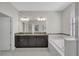 Bathroom boasts a double vanity, granite countertops, and a luxurious soaking tub at 1339 Shinnecock Hills Dr, Davenport, FL 33896