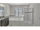 Bathroom featuring a granite countertop vanity, soaking tub, and glass enclosed shower at 1339 Shinnecock Hills Dr, Davenport, FL 33896