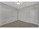 This bedroom features neutral walls, carpet, two white doors and overhead lighting at 1339 Shinnecock Hills Dr, Davenport, FL 33896