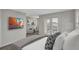 Stylishly decorated bedroom leading to an outdoor balcony with views of the neighborhood at 1339 Shinnecock Hills Dr, Davenport, FL 33896
