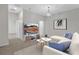 This living room features neutral walls, carpet, modern furniture and a stylish décor at 1339 Shinnecock Hills Dr, Davenport, FL 33896