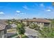 Charming street view showcasing well-maintained townhomes and landscaping under a bright, sunny sky at 1339 Shinnecock Hills Dr, Davenport, FL 33896
