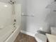 Bathroom featuring a white shower and tub with a white toilet and vanity at 13839 Fairway Island Dr # 1128, Orlando, FL 32837