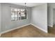 Dining room with tile flooring and modern light fixture, with a window view at 13839 Fairway Island Dr # 1128, Orlando, FL 32837