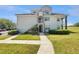 Charming condo building with easy access stairs and lush landscaping around the property at 13839 Fairway Island Dr # 1128, Orlando, FL 32837