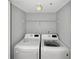 Laundry room featuring a washer and dryer with white wire rack at 13839 Fairway Island Dr # 1128, Orlando, FL 32837