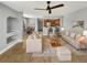 Living and dining area with tile flooring, ceiling fan, and open bar to the kitchen at 13839 Fairway Island Dr # 1128, Orlando, FL 32837