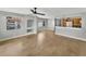 Open living area featuring tile flooring, a ceiling fan, and natural light from the windows at 13839 Fairway Island Dr # 1128, Orlando, FL 32837