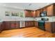 Updated kitchen with modern appliances, granite countertops, and beautiful wooden cabinetry at 1405 Pioneer Trl, New Smyrna Beach, FL 32168