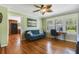 Bright office space featuring hardwood floors, ample natural light, and serene views to kitchen at 1405 Pioneer Trl, New Smyrna Beach, FL 32168