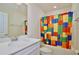Bathroom featuring a vanity and a colorful shower curtain at 14374 Lanikai Beach Dr, Orlando, FL 32827