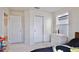 Neutral toned bedroom with a large closet and bright natural lighting at 14374 Lanikai Beach Dr, Orlando, FL 32827