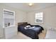 Bright bedroom featuring a wooden bed frame and a comfortable looking bed at 14374 Lanikai Beach Dr, Orlando, FL 32827