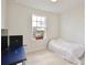 Bedroom with a window, bed, and desk at 14374 Lanikai Beach Dr, Orlando, FL 32827