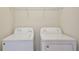 Image of a white washer and dryer appliances, with shelf at 14374 Lanikai Beach Dr, Orlando, FL 32827