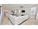 Bright living room with tile floors, recessed lighting, and a view of the dining and kitchen areas at 14374 Lanikai Beach Dr, Orlando, FL 32827