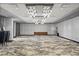 Expansive ballroom featuring modern chandeliers, a patterned floor, and ample space for gatherings at 14501 Grove Resort Ave # 3335, Winter Garden, FL 34787