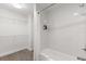 Bathroom features a shower-tub combo with white tile surround and a closet with wire shelving at 14501 Grove Resort Ave # 3335, Winter Garden, FL 34787