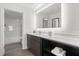 Stylish bathroom with sleek vanity, bright lighting, and a glimpse of the shower-tub combo at 14501 Grove Resort Ave # 3335, Winter Garden, FL 34787