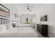 Comfortable bedroom features two queen-sized beds, neutral decor, and a modern ceiling fan at 14501 Grove Resort Ave # 3335, Winter Garden, FL 34787