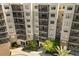 Exterior shot showing lush landscaping and building facade providing a tranquil welcome to residents and guests at 14501 Grove Resort Ave # 3335, Winter Garden, FL 34787