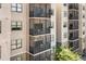 Condo building exterior featuring multiple balconies, offering residents outdoor living at 14501 Grove Resort Ave # 3335, Winter Garden, FL 34787