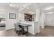 Modern kitchen with sleek countertops, stainless steel appliances, and an open dining area at 14501 Grove Resort Ave # 3335, Winter Garden, FL 34787